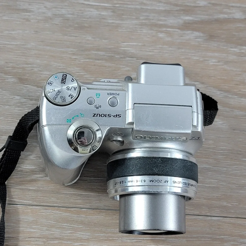 Olympus SP-510UZ 7.1 Megapixel Digital Camera 10x Optical Zoom Silver No Cap